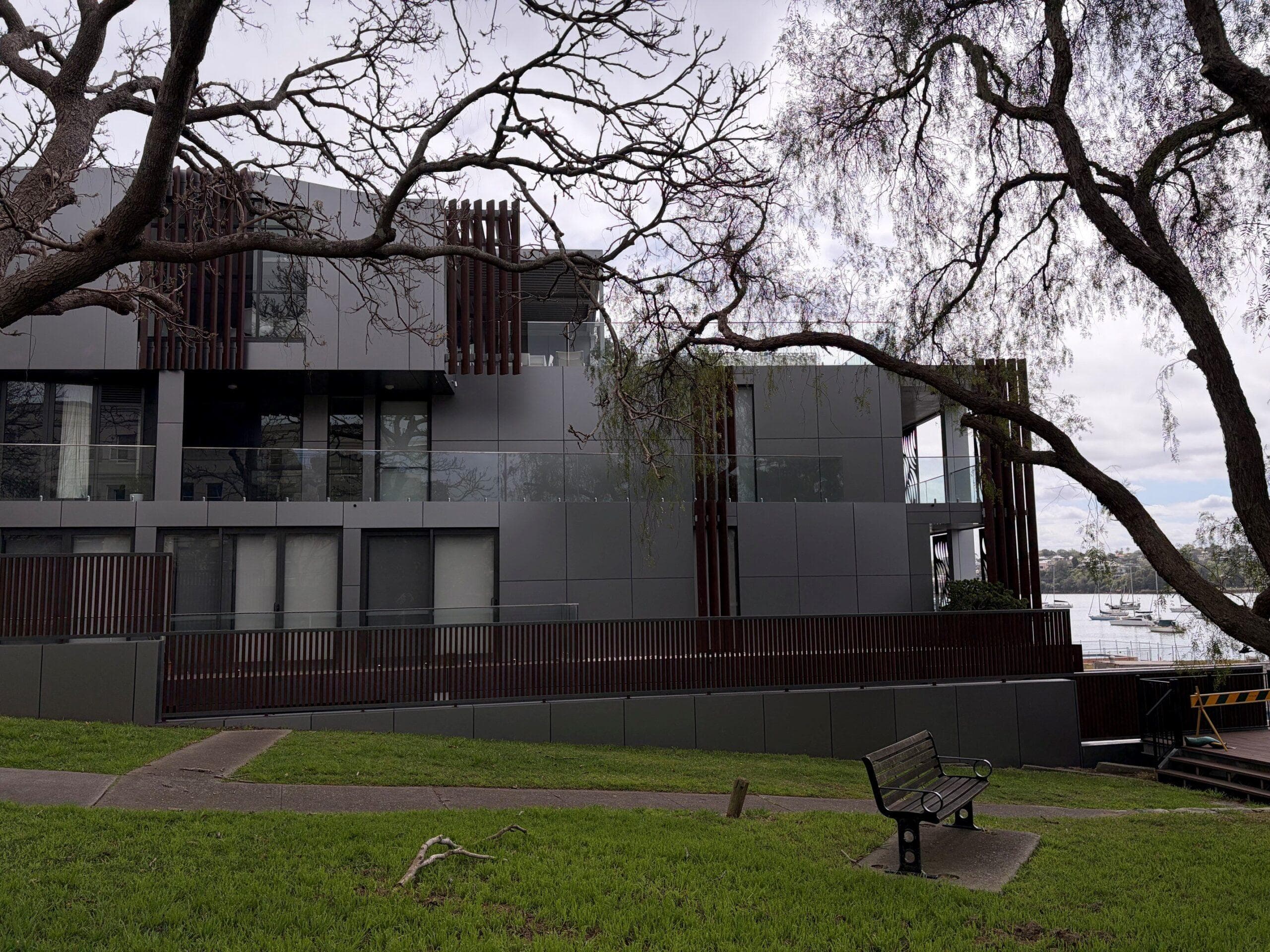 Waterfront elevation of Breeze Apartments featuring ALPOLIC™ NC/A1 recladding and vertical architectural fins