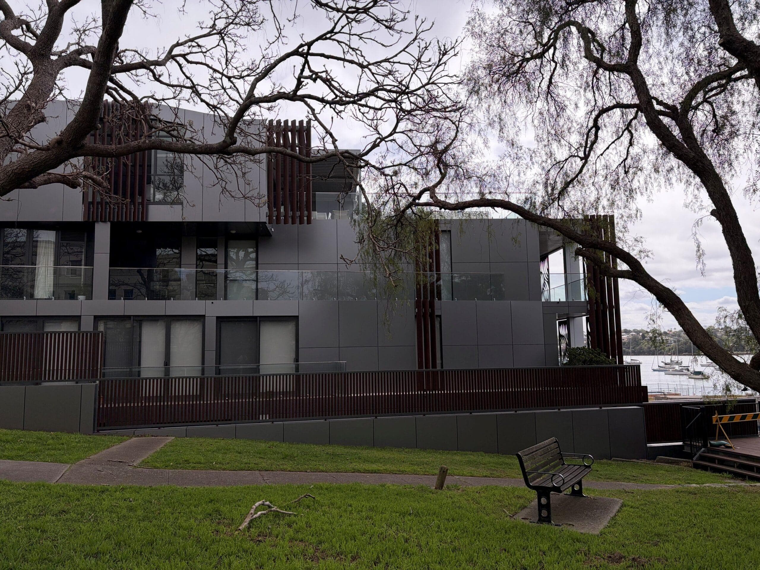 Waterfront elevation of Breeze Apartments featuring ALPOLIC™ NC/A1 recladding and vertical architectural fins