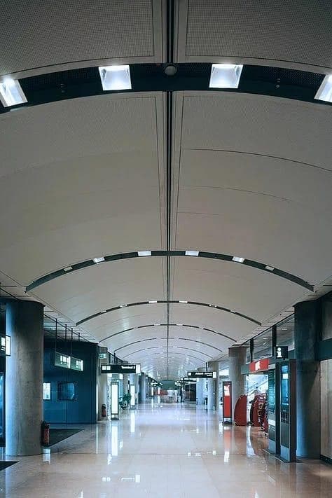 Durlum DOMUS curved metal ceiling panels at Hamburg Airport in Germany.