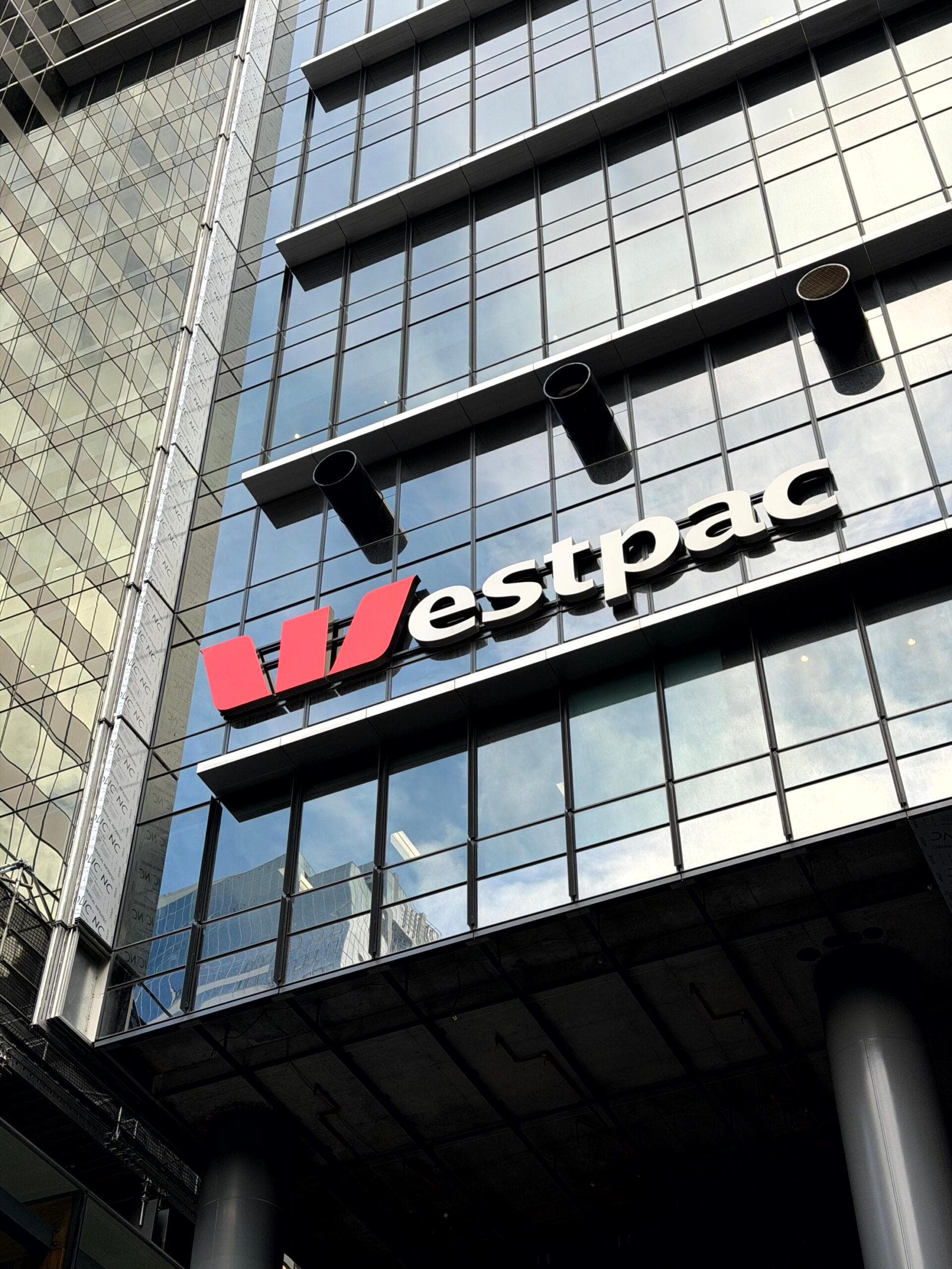 Westpac signage mounted on the glass façade beside ALPOLIC™ recladding panels