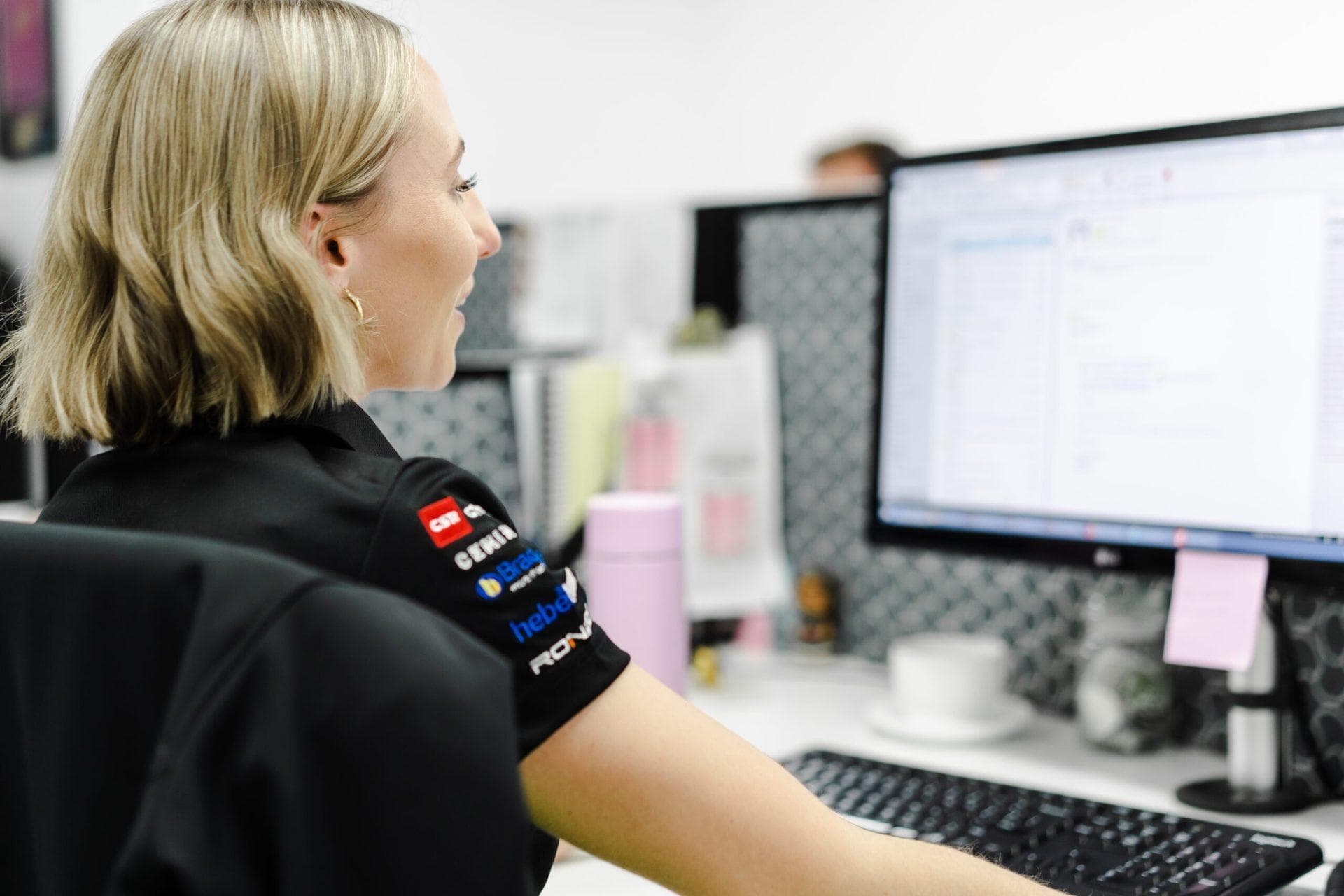 Office staff working at computer desk