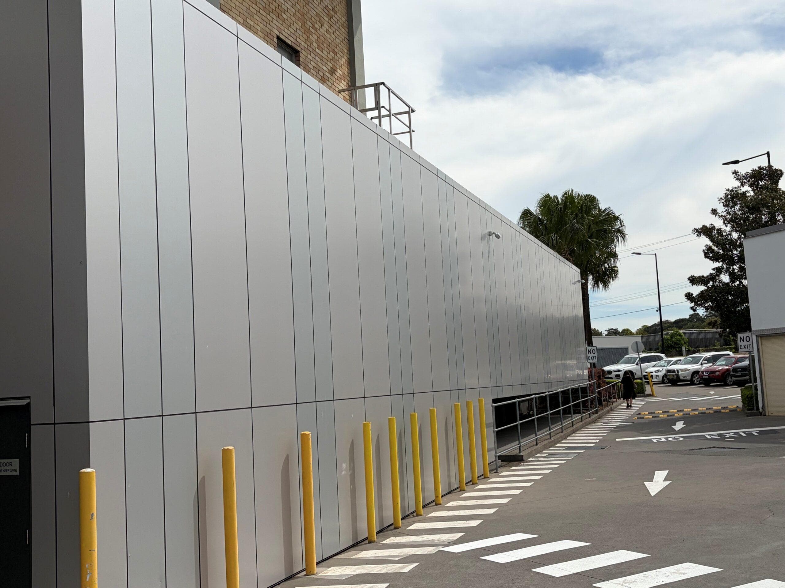 Close perspective of ALPOLIC™ metallic panels along the pedestrian walkway