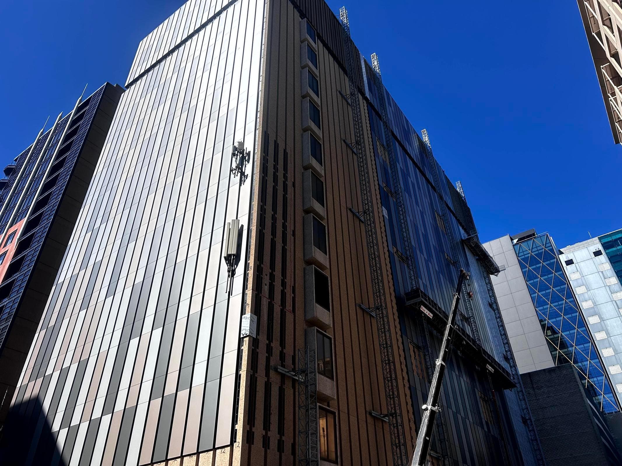 Large-scale ALPOLIC™ NC/A1 recladding of Telstra Waymouth data exchange showing multi-tonal metallic panels
